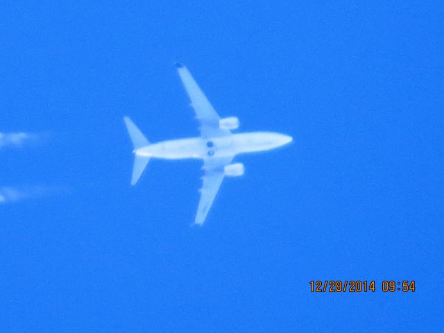 Boeing 737-700 (C-FWSY) - WestJet Airlines flight 2211 from Cancun to Edmonton British Columbia over Baxter Springs Kansas (78KS) at 38,000 feet.