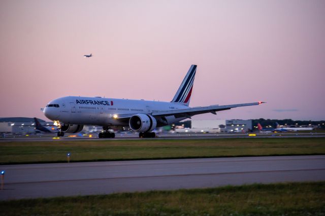 Boeing 777-200 (F-GSPE) - Equipment swap for the day and a hour delay made for a nice photo. AF378 with the mains planted on 21L after its flight from Charles de Gaulle.