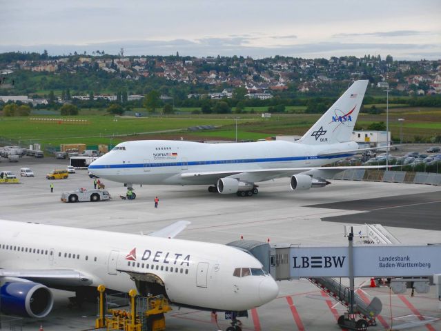 N747NA — - SOFIA was flown from Cologne, Germany, home of the German Aerospace Center, to the Stuttgart Airport, home of the nearby German SOFIA Institute located at the University of Stuttgart on the morning of Sept. 19, 2011. No science was conducted during the short flight, approximately 290 km (180 miles) between the two cities.     "Our move to Stuttgart enables our partners at the German SOFIA Institute to showcase the observatory to its researcher staff, invited guests, and the general public," said NASA SOFIA Program Manager Bob Meyer. "In addition to the German SOFIA Institute, many people and companies in Germany have contributed to our success. SOFIA’s telescope was built by MT-Aerospace AG and Kayser-THrede GmbH under the direction of the German Aerospace Center, and we are flying the German Receiver for Astronomy at Terahertz Frequencies (GREAT) that was developed by a team led by researchers at the Max Planck Institute for Radio Astronomy. Those teams, and many others, should be proud of what has been achieved to date with SOFIA."     While at Stuttgart, the aircraft can be seen from the upper deck of the Stuttgart Airport terminal where the German SOFIA Institute has a science display. The aircraft will depart for a science flight across the Atlantic Ocean on Wednesday, Sept. 21.     SOFIA’s display at Stuttgart is the second stop on the observatory’s first international deployment. Science was conducted on the east-bound leg, on Sept. 16/17, and the GREAT instrument will again collect infrared observational data on the west-bound flight. The aircraft will land in the United States on the morning of Sept. 22, 2011.     http://www.nasa.gov/mission_pages/SOFIA/page2new_rd.html