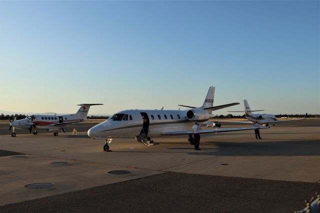 Cessna Citation Excel/XLS (N560CG) - KRDD - Early AM Bizjet awaiting passengers sharing the ramp with a Calstar plane and another jet - Redding is usually not this busy in the early AM. July 2019