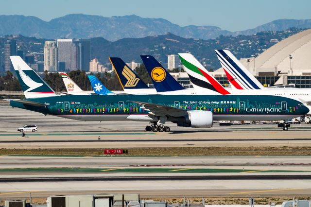 BOEING 777-300ER (B-KPB) - The City of Hong Kong taxing past the TBIT