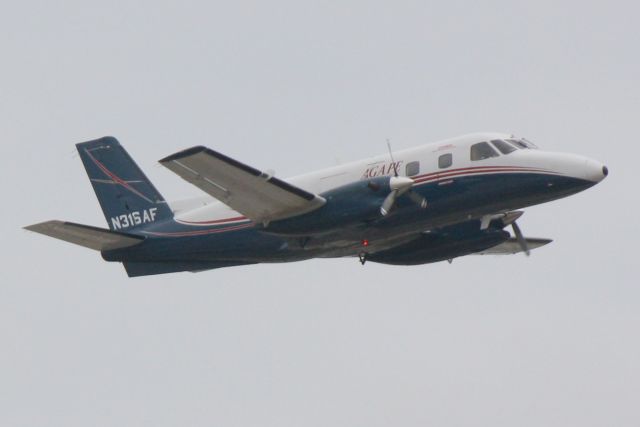 Embraer EMB-110 Bandeirante (N316AF) - N316AF departs Runway 14 at Sarasota-Bradenton International Airport