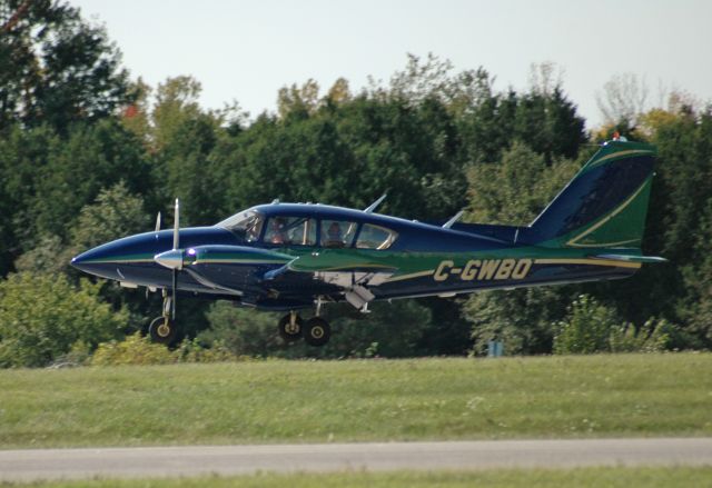 Piper Apache (C-GWBO) - Piper PA-23-250 Aztec (Serial: 27-4569) coming in for a landing during the Doors Open 2015 event at CYOO/YOO (September 26, 2015)