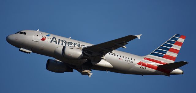 Airbus A319 (N703UW) - From the top of the RDU parking deck, 4/14/18.