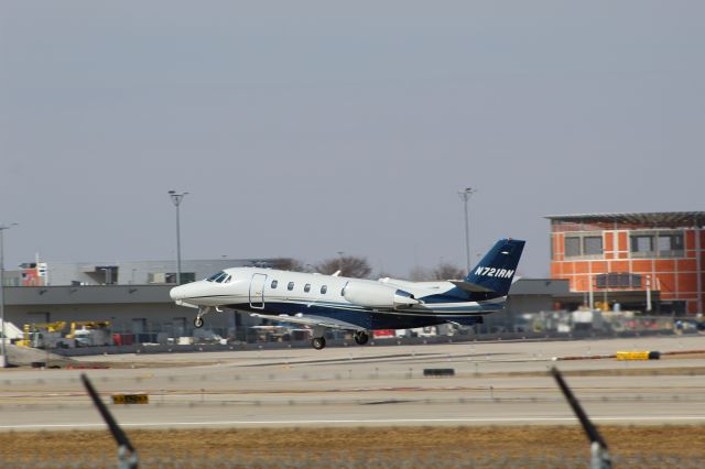 Cessna Citation Excel/XLS (N721RN) - Citation doing a couple of touch and goes at Grand Rapids International Airport runway 26L