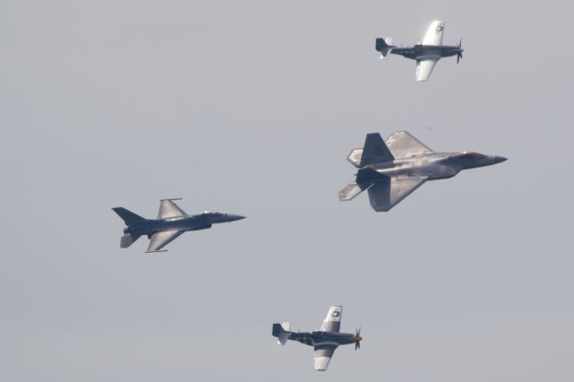 — — - USAF ACC Heritage Flight with two P-51s, an F-16 and F-22 in May 2019