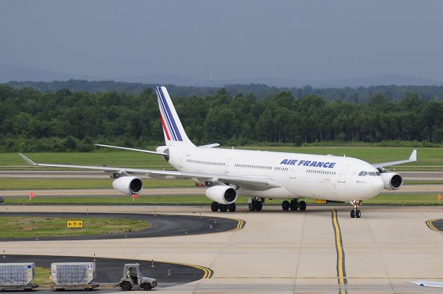 Airbus A340-300 (F-GLZP) - Seen at KIAD on 7/25/2009.  Dark overcast, light rain.