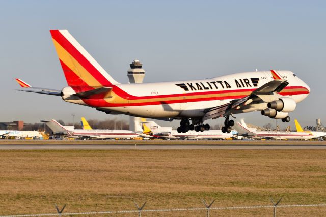 Boeing 747-400 (N709CK) - Moments from touchdown on to 36-R. to me what makes this photo is the three Kalitta Charter 727-200F's in the background. It's semi-rare to see one 727 anymore, let alone three parked adjacent to each other, except perhaps it's common in CVG? Anyway, a rare treat for me.