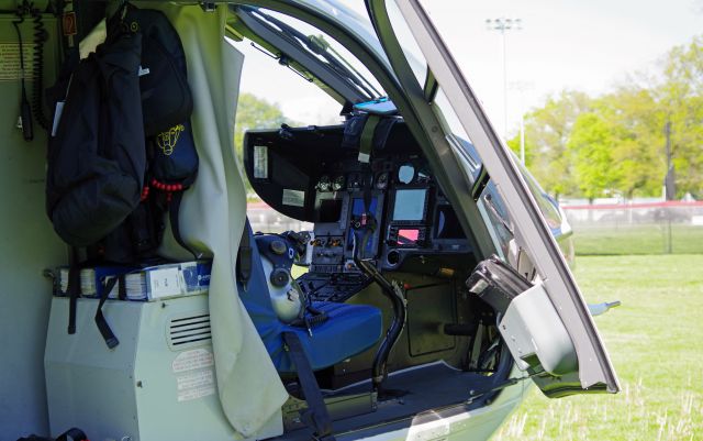 Eurocopter EC-635 (N732HM) - RAHWAY, NEW JERSEY, USA-MAY 09, 2022: The pilot's seat of a medical transportation helicopter is pictured while on the ground in front of the Rahway Middle School preparing for a flight from Robert Wood Johnson Hospital-Rahway, N.J. to Robert Wood Johnson Hospital-New Brunswick, N.J. When transporting to or from RWJ-Rahway, the helicopter will use the school's ball field as a landing zone because the hospital lacks a permanent fixed heli-pad. As such, it uses the nearest fixed heli-pad as its landing code, Merck & Company's 7NJ8, located about a mile away.