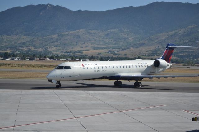 Canadair Regional Jet CRJ-700 (N707EV) - Delta Connection CRJ-550 taxiing to it's parking spot after a flight from KSLC (SKW4315). There's so much room on the plane, especially in first. (The CRJ-550 is the same length as CRJ-700, but has the same number of seats as CRJ-200)br /br /Photo taken at 10:27 MDT, on Aug 17, 2024br /Camera: Nikon D3100 (1/250, ISO 100)br /Lens: Nikon AF-S 18-55mm 3.5-5.6G VR (55mm, ƒ/5.6)