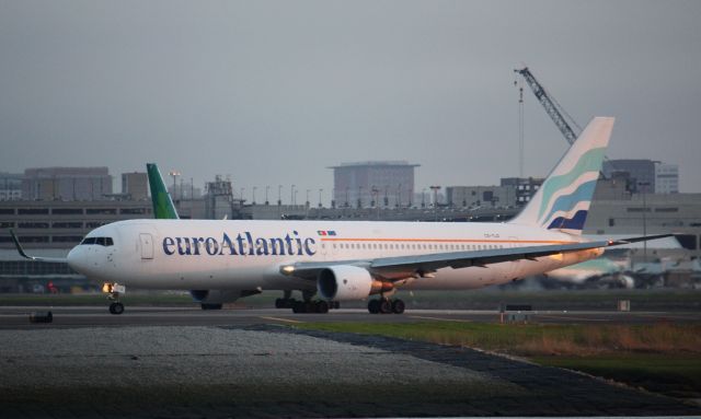 BOEING 767-300 (CS-TLO) - Operating for TACV departing Logan at sunset for Praia.