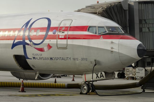 Boeing 737-800 (9M-MXA) - 29th Dec., 2019: Wearing a retro-livery celebrating 40 years of operation of Malaysian Airlines, she's seen parked at the gate at Kuala Lumpur International Airport. 