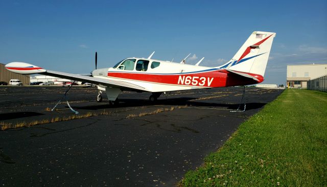 Beechcraft Bonanza (33) (N653V) - Early morning, just checking tie-downs for interesting planes