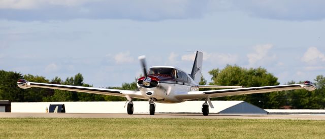 Piper PA-24 Comanche (N6494P) - EAA22, on flightline.