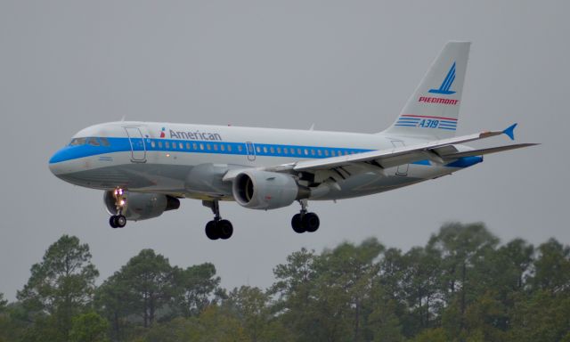 Airbus A319 (N744P) - A rainy afternoon in Myrtle Beach South Carolina, but nothing would hold me back to see a Heritage livery!