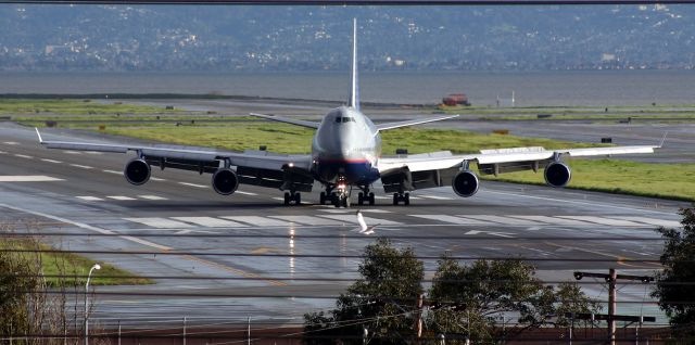 Boeing 747-400 (N182UA) - KSFO - N182UA turning R off 19L at SFO. Click full view...