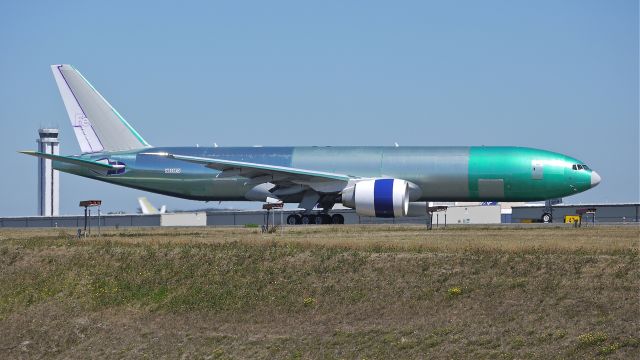 Boeing 777-200 (N859FD) - BOE65 taxis to Rwy 34L for a fast taxi / brake test after completion of its maiden flight on 8/21/13. (LN:1134 cn 37730).