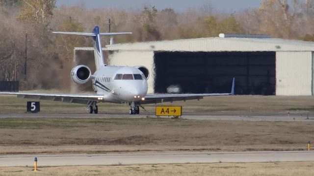 Canadair Challenger (N221BW) - N221BW taxing off RWY 17 after landing at Sugarland Regional Airport KSGR. shot with my Sony Cybershot DSC HX100V