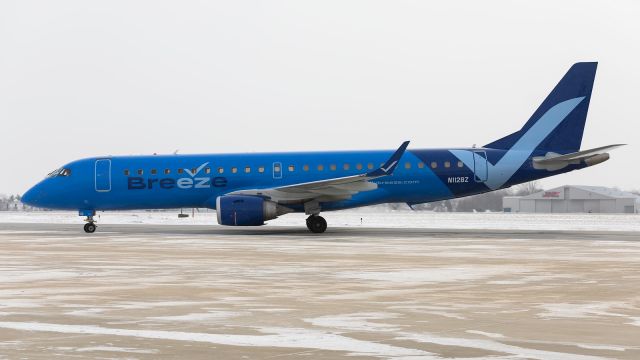 Embraer ERJ-190 (N112BZ) - Breeze Airways E190AR pulls into Corporate Wings ramp at KSBN.