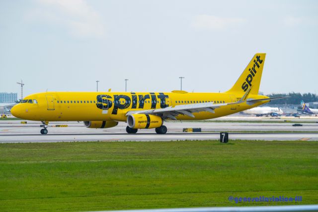 Airbus A321 (N686NK) - Rainy day landing at runway 28L for FLL airport.  Photographed from visual obstruction free aircraft observation park (bring a picnic) at FLL airport.  1800 SW 39th St, Fort Lauderdale, FL 33315