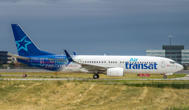 Boeing 737-800 (C-GTQC) - This Air Transat B738 taxis to runway 06R to depart for Cancun as TSC840