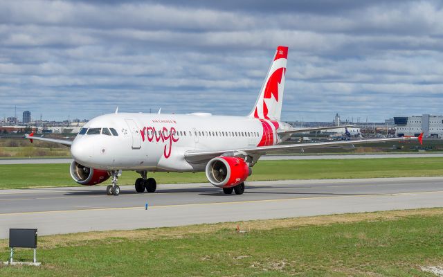 Airbus A319 (C-FYIY) - ROU1861 backtracks along a parallel taxiway to her gate at Terminal 1