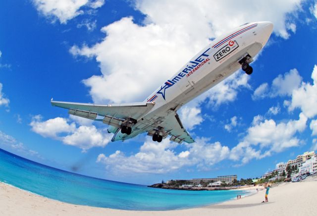 Boeing 727-100 (N994AJ) - With a puff of exhaust ZERO ONE zooms over MAHO.