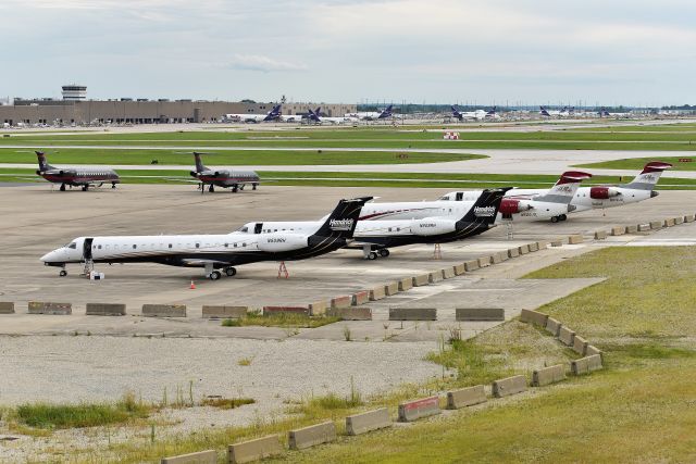 Embraer ERJ-145 (N508RH) - Three racing teams aircraft on the Signature overflow ramp 08-13-23. Hendricks Racking: N509RH - N508RH - Joe Gibb's Racing: N520JG - N519JG - Dale Earnhardt/Champion Air: N3DE - N138DE. 08-13-23. Getting ready to depart after the Brickyard Race was over.