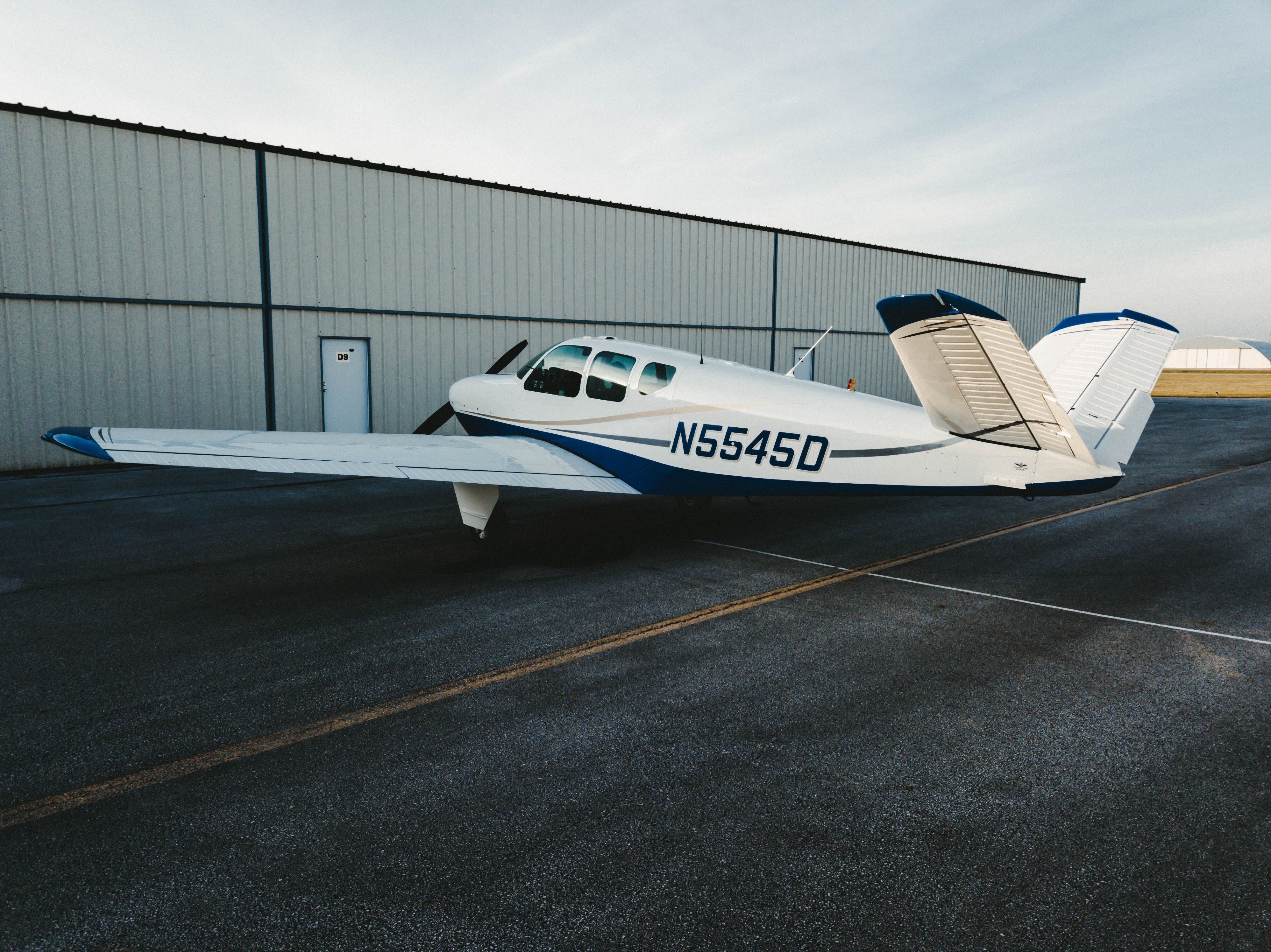 Beechcraft 35 Bonanza (N5545D) - Pushing the plane back in the hangar after a great evening trip.