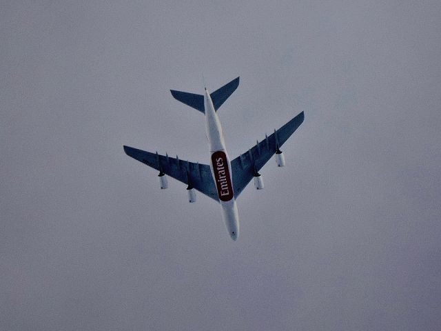 Airbus A380-800 (A6-EEK) - EK434 flies under clouds in Colombo.