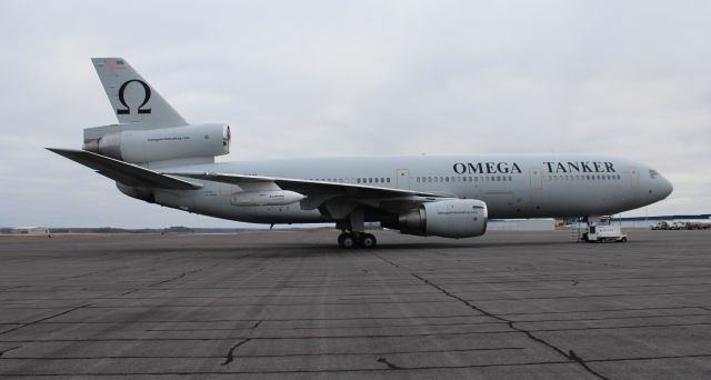 McDonnell Douglas DC-10 (N974VV) - Omega Tankers McDonnell Douglas DC-10-40 under overcast skies on the ramp at Carl T. Jones Field, Huntsville International Airport, AL - December 19, 2016. Shot from inside the passenger side of a vehicle moving at a walking pace around the aircraft.