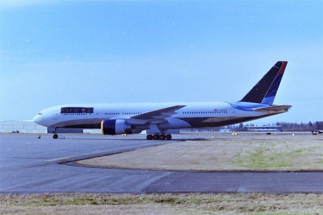 Boeing 777-200 (N863DA) - KPAE - Apprx April 1999 - This was kinda pre Internet days for me and I was up visiting family in Everett,WA and I cruised the Boeing Complex daily the week I was up there. I have posted this before on other sites, but this was a total scoop photos I had here, and didn't know it. I actually, being a dork sometimes, thought this was Aeroflot 777 with a fake reg. But Nooooooo. I snapped away then continued my Complex cruise. The next day we were down by the old Goodrich Aerospace building and this jet was being towed into the paint hangar at the south end. I got photos there and some video. i thought I had a great Aeroflot scoop. But Nooo again. back when I had to process the film at Konica Labs in Santa Clara, I'd amass 20 rolls of 36 exp and I'd take them in all at once for developing, forgetting what I had on each roll. So, I finally got around to looking up the reg, don't even remember how I did that back then, the newest Airliners magazine arrives, and this jet is in the New photos section, I got torched! It was Delta new colors!