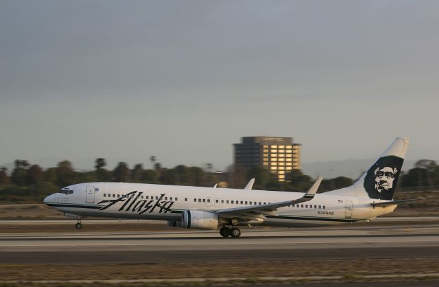 Boeing 737-700 (N306AS) - Early morning take off from runway 24 Right.