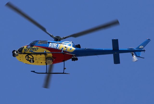 Eurocopter AS-350 AStar (N71HD) - Flying over the airport.