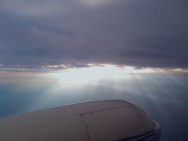 Fairchild Dornier SA-227DC Metro (N54GP) - Sun shining through the clouds on a flight to KISM