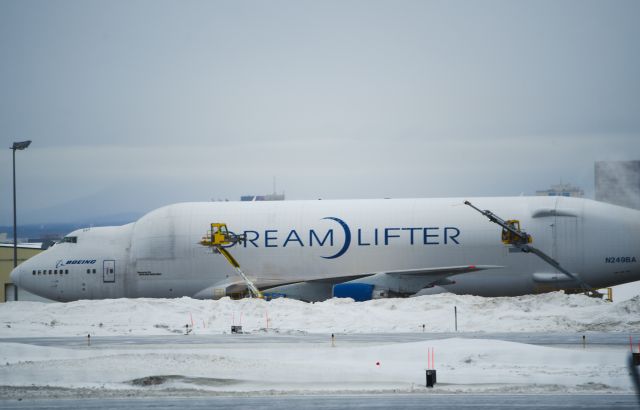 Boeing 747-200 (N249BA) - Standing on west side of airport.  De-Icing in process before takeoff.