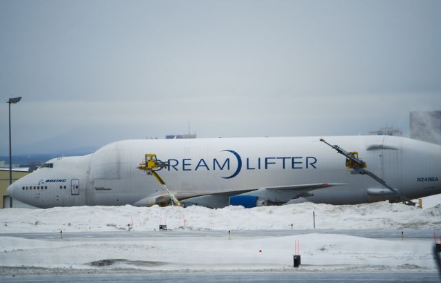 Boeing 747-200 (N249BA) - Standing on west side of airport.  De-Icing in process before takeoff.