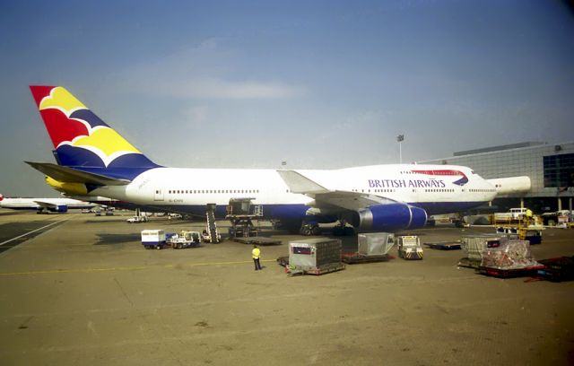 Boeing 747-400 (G-CIVU) - Sitting at the gate circa 1999 or 2001.   Found the negs in an old box of photos. Pre digital, so I had to scan the negs. Sorry for the lousy quality. : )  I was on a Delta flight back to Florida via KATL. There was this monster with a brilliant paint job. BA were going through a see how much money we can spend on paint effort back then. But it was stunning.