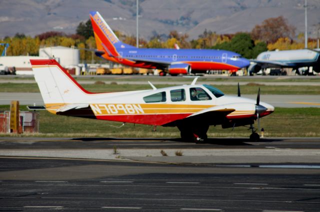 Beechcraft Twin Bonanza (N7098N) - When I Grow Up .. Baron and Southwest prepare for departure, respectively from 3-0-L and 3-0-R