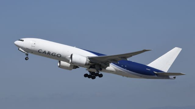 BOEING 777-200LR (N703GT) - Departing LAX on 25R