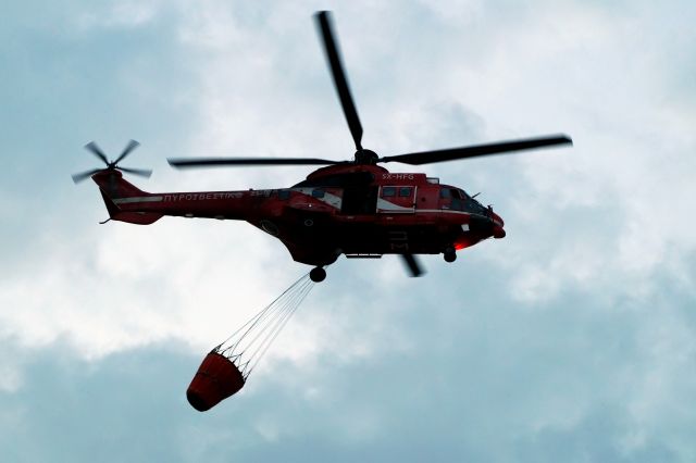 Eurocopter Super Puma (EC-225) (SX-HFG) - Fire Fighting Service Super Puma preparing to land after an extremely hard work over blazing fires in Athens.Respect to our heroes.