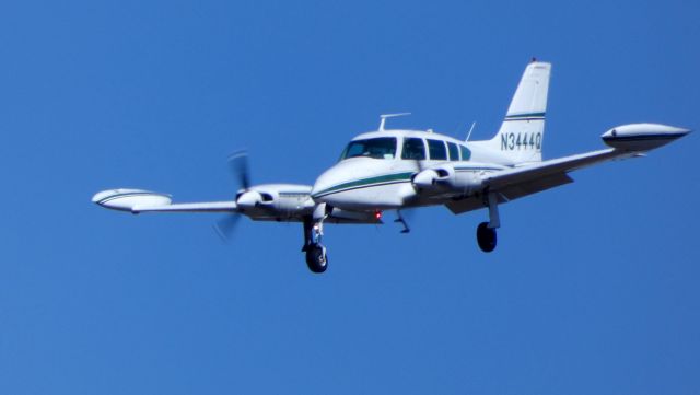 Cessna Executive Skyknight (N3444Q) - On final is this 1966 Cessna 320E Twin Turbo-Prop Executive Skynight in the Winter of 2019.