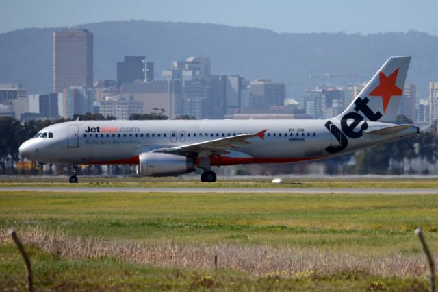 Airbus A320 (VH-JQX) - On taxiway heading for Terminal One after landing on runway 23.  Monday 25th August 2014. 