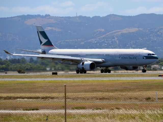 Airbus A330-300 (B-HLQ) - Slowing down on runway 23, on arrival from Hong Kong.
