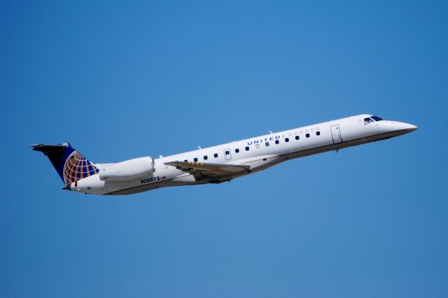 Embraer ERJ-145 (N13975) - Departing for Chicago.