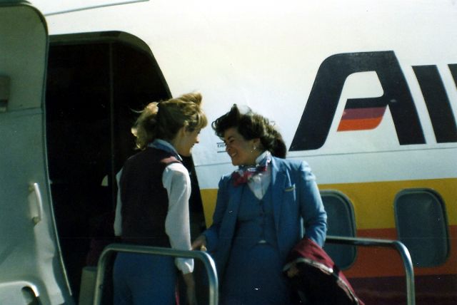 Boeing 737-200 — - KSJC - 2 Air CAL Stewardesses chat it up as this jet is readied for a return to KSNA>photo from the old KSJC Obs Deck ( now closed ) Minolta XD-11 w/1000mm lens