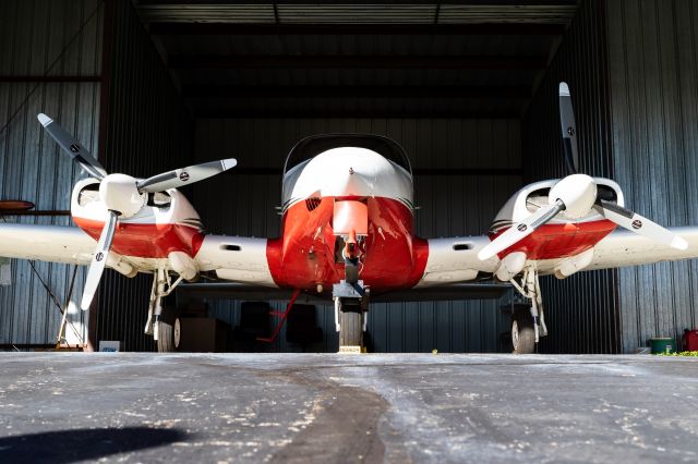 Cessna 310 (N647TW) - Cessna 310Q after being pushed into its hangar.