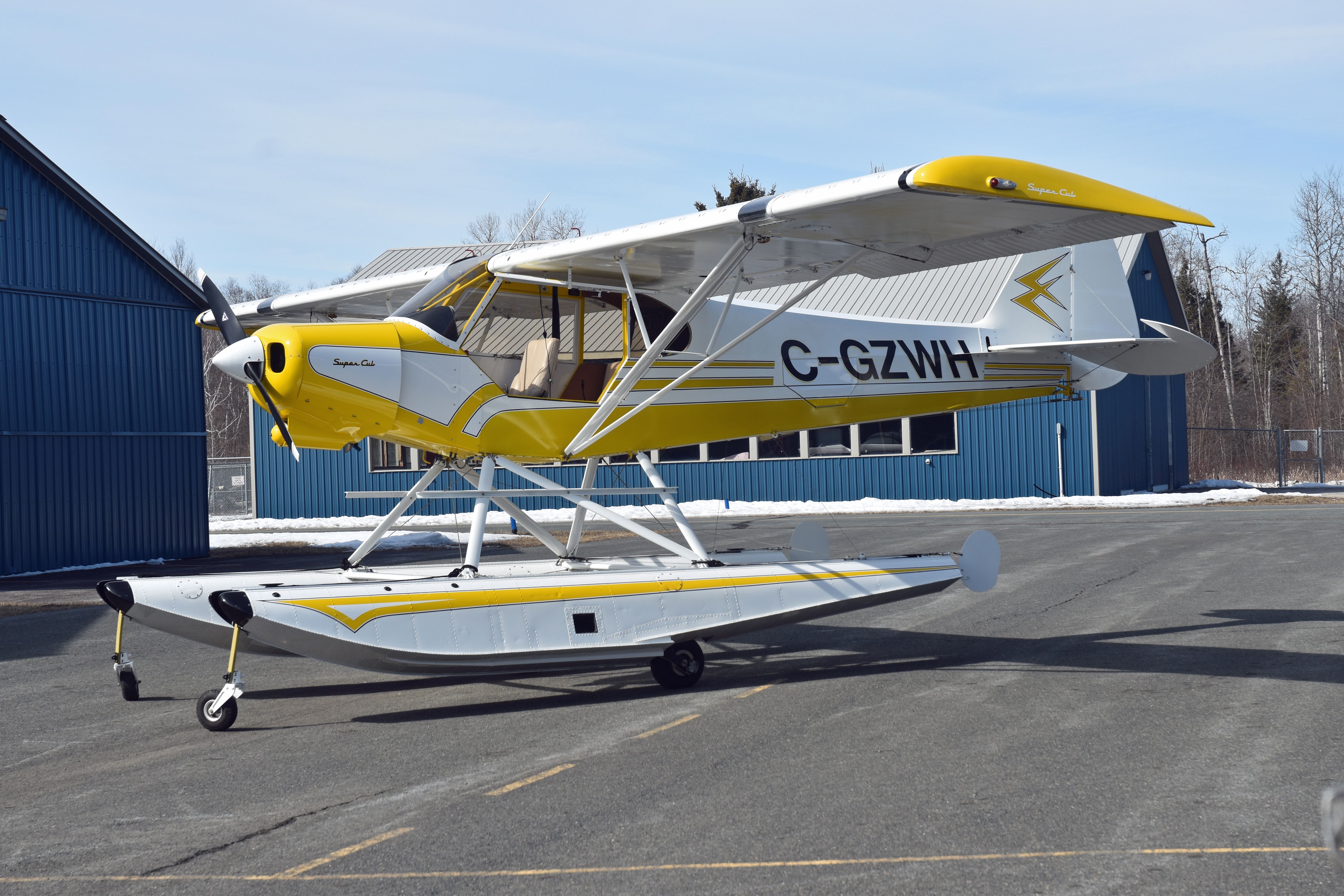 Piper L-21 Super Cub (C-GZWH) - 2003 Piper PA-18 Lazure Cub (C-GZWH/1098) sitting outside of its hangar on March 9, 2021