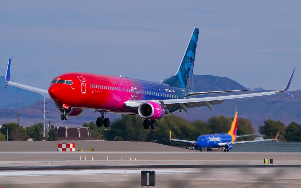 Boeing 737-900 (N493AS) - Alaskas MORE TO LOVE 737-900ER coming in to land as a Southwest 737-800 waits for departure clearance.