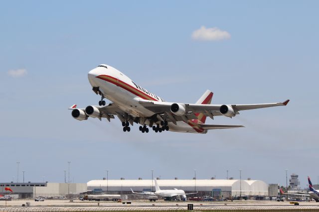 Boeing 747-400 (N710CK) - Miami (MIA). Kalitta Air flight K4539 climbs away from runway 27 departing for Santiago Arturo Merino Benítez (SCL). br /Taken from El Dorado Furniture Store, NW 72nd Avenue adjacent to runway 27/09 south of the airfieldbr /br /https://alphayankee.smugmug.com/Airlines-and-Airliners-Portfolio/Airlines/AmericasAirlines/Kalitta-Air-K4/br /br /2021 05 01